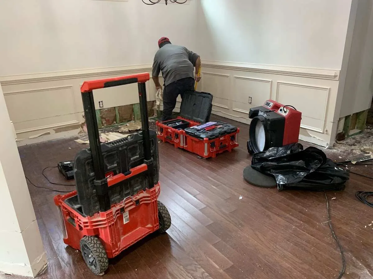 Technician setting up drying equipment for water damage in Castroville